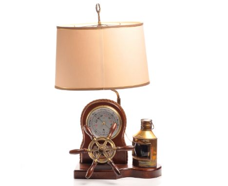 MID-CENTURY NAUTICAL BAROMETER LAMP WITH SHIP'S WHEEL AND SIGNAL LANTERN the unsigned silvered dial with Arabic numerals, the