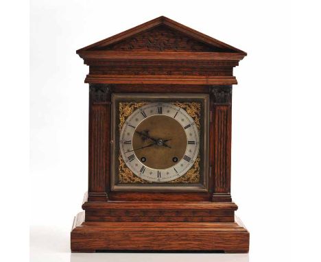 EALRY TWENTIETH CENTURY WINTERHALDER AND HOFMEIER CARVED OAK AND WALNUT BRACKET CLOCK
the signed two train movement striking 