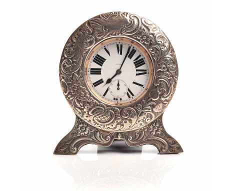 EDWARD VII SILVER MOUNTED TRAVEL DESK CLOCK
1902-1903, the silver case front with floral decoration in relief, with a cut out