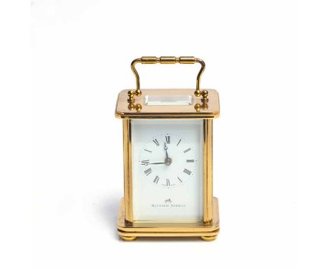 TWENTIETH CENTURY MATTHEW NORMAN BRASS CARRIAGE CLOCK
the signed eleven jewels single train eight day movement numbered 1754,