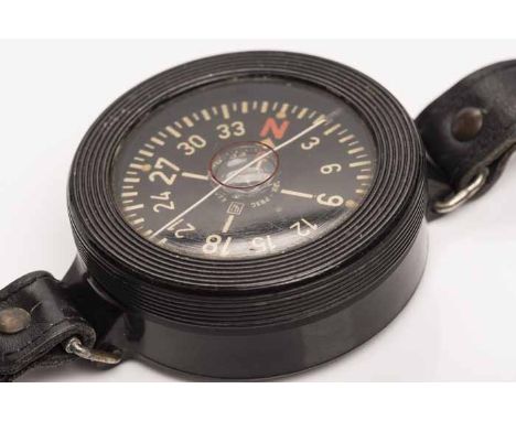 GERMAN WWII LUFTWAFFE BAKELITE PILOT'S COMPASS
the black dial with yellow numerals, the 61mm circular bakelite case marked ve