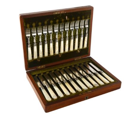 A set of hallmarked silver and mother-of-pearl handled dessert knives and forks for 12 people, in original walnut case 