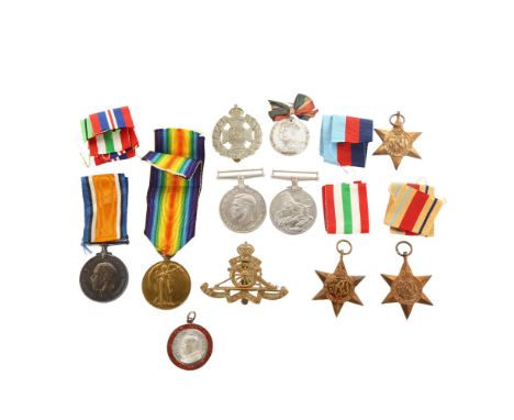 A collection of Great War and Second World War General Service medals, cap badges and medallions.&nbsp;First War medals inscr