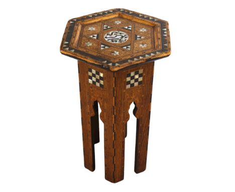 A small Anglo-Moorish hexagonal occasional table in the manner of Liberty & Co, with inlaid mother-of-pearl marquetry, 33cm a