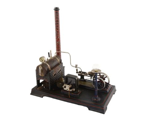 A live steam-powered model stationary engine by Doll & Co Germany, early 20th century, on tinplate platform base with painted