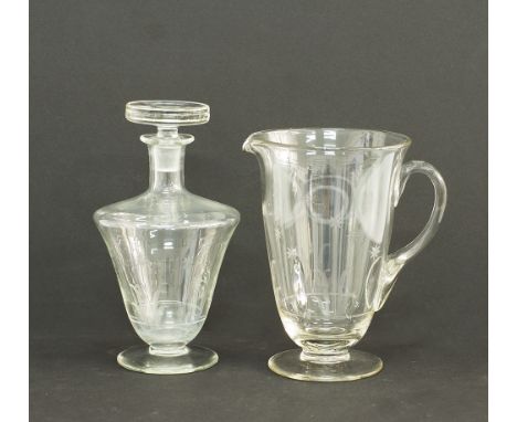 An engraved glass pitcher and decanter, H26cm and H23cm, mid century. (2)