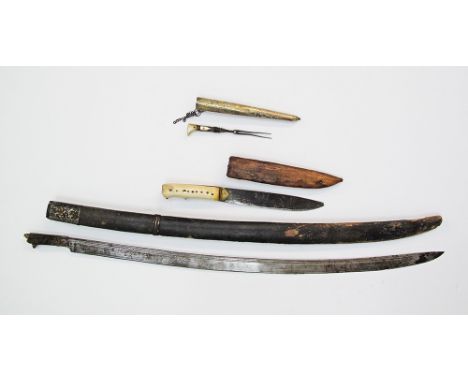 An antique Shashka sword with a wooden scabbard covered in leather together with a Cretan bichaq dagger with bone hilt and le