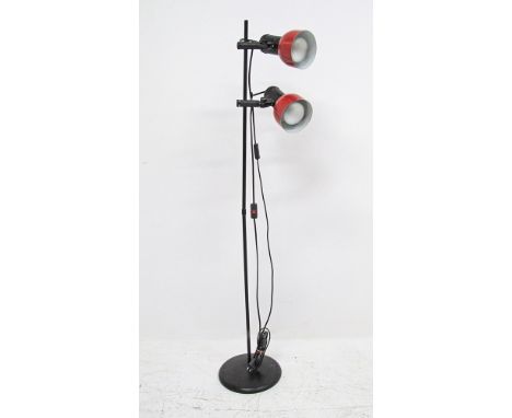 A modern floor lamp with two adjustable spotlights in red enamel shades, measuring H134cm, late 20th century.