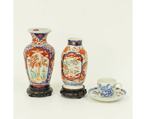 A collection of two Japanese Imari porcelain vases on hardwood stands, measuring H21cm and H19cm incl. stands. Together with 