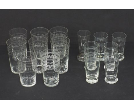 Vintage glasses. A collection of vintage clear glasses engraved with various designs, the tallest H10cm, early 20th century. 