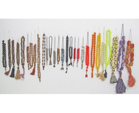 A collection of twenty eight worry beads / kombologia / rosary, comprising wood, seed, plastic, metal, glass and various othe