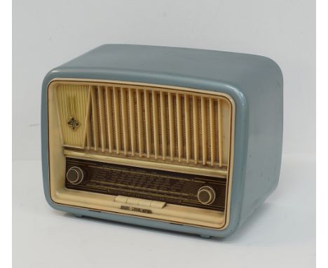 A vintage Telefunken table Radio, model D657W, the Bakelite case in light blue, with push buttons, measuring W37cm, D21cm, H2