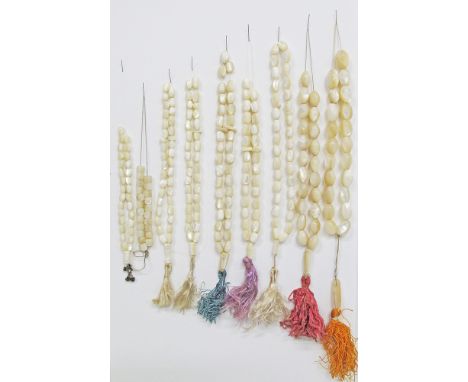 A collection of nine mother of pearl worry beads / kombologia / rosary, 19th and 20th century. From left to right: [oval - 27