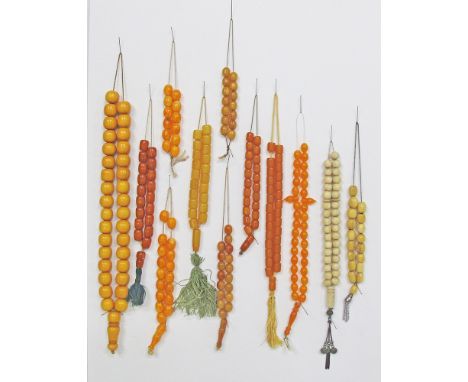 A collection of twelve worry beads / kombologia / rosary, comprising light amber colour, masticha and ivory beads. The larges