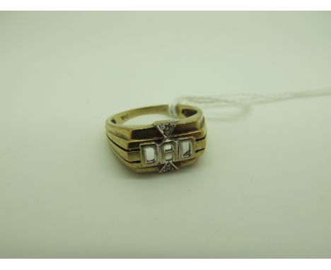 A 'Dad' Signet Style Ring, of openwork design, inset highlights, between wide reeded shoulders, stamped "375" (finger size R)