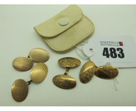 A Pair of 9ct Gold Cufflinks, the engine turned oval panels on chain connections; together with another pair of 9ct gold cuff