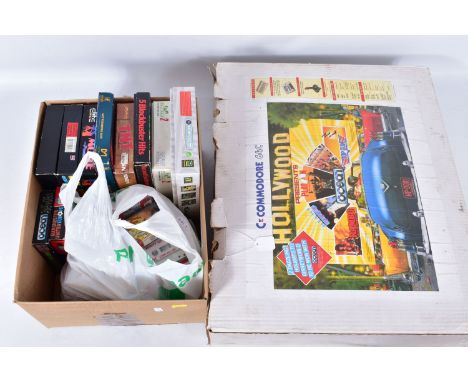 COMMODORE 64C COMPUTER BOXED WITH A QUANTITY OF GAMES, computer includes a tape player, user manual and two joysticks (one of