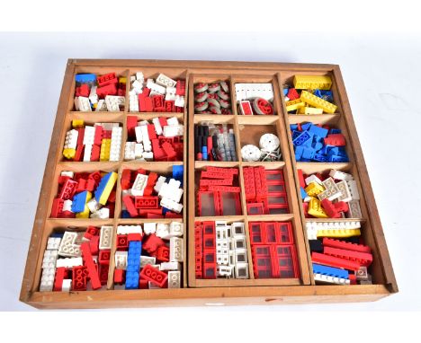 AN ORIGINAL WOODEN LEGO SYSTEM BOX, containing a quantity of 1960's and 1970's Lego, to include Fire Engine, road signs and r