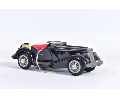 AN UNBOXED BANDAI TINPLATE FRICTION DRIVE M.G. SPORTS CAR, black body with red interior, cream tonneau cover, complete with f