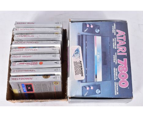 A BOXED ATARI 7800 AND GAMES, An Atari 7800 complete in its original box with power suply, coaxial cable and two controlers; 