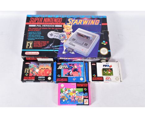 SUPER NINTENDO ENTERTAINMENT SYSTEM BOXED WITH A QUANTITY OF GAMES, games include Doom, Starwing, Dino Dino's Soccer and Tiny