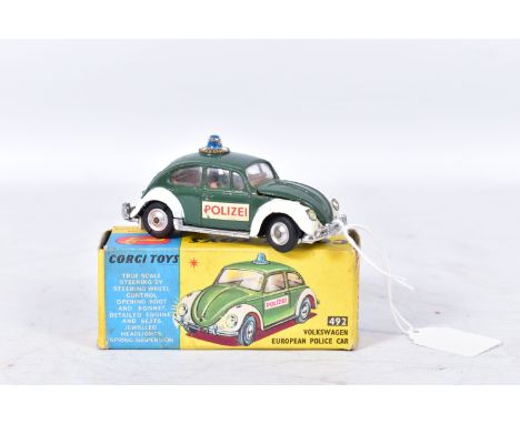 A BOXED CORGI TOYS VOLKSWAGEN BEETLE EUROPEAN POLICE CAR, No.492, playworn condition missing decal from one door and has some