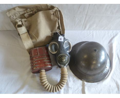 WWII British army helmet and gas mask in khaki bag