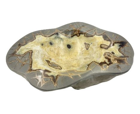 Septarian dish, with a calcite centre and argonite/siderite lines within limestone rock and rough outer edges, H6cm, L25cm