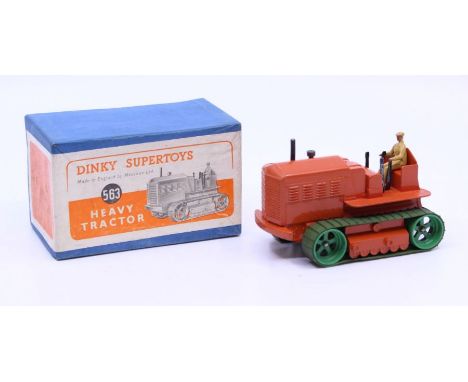 Dinky: A boxed Dinky Toys, Heavy Tractor, Reference No. 563, orange body with green rollers. Original box, general wear expec