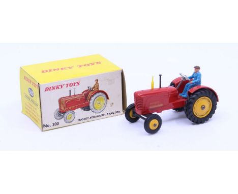 Dinky: A boxed Dinky Toys, Massey-Ferguson Tractor, Reference No. 300, red body, yellow wheel hubs, one black and one yellow 