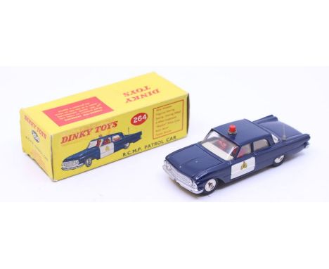 Dinky: A boxed Dinky Toys, R.C.M.P. Patrol Car, Reference No. 264, blue with off-white doors, white interior with two figures