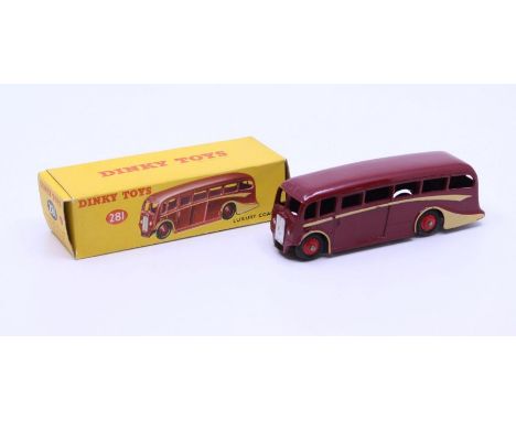 Dinky: A boxed Dinky Toys, Luxury Coach, Reference No. 281, maroon body, cream side flashes and red wheel hubs. Original box,