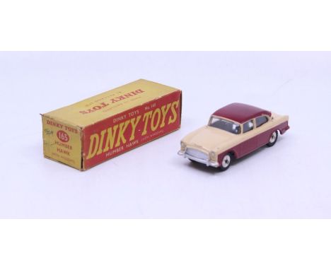 Dinky: A boxed Dinky Toys, Humber Hawk (with Windows), Reference No. 165, beige and maroon two-tone body, with silver hubs. O