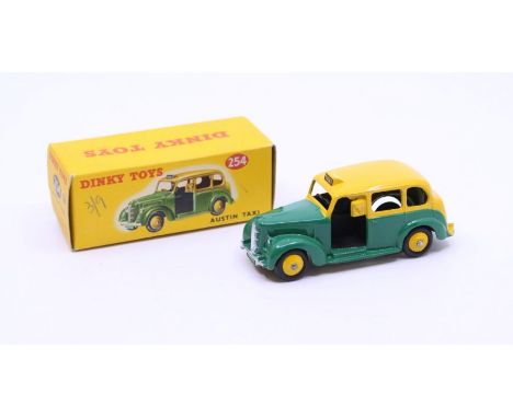 Dinky: A boxed Dinky Toys, Austin Taxi, Reference No. 254, two-tone green and yellow body. Original box, general wear expecte