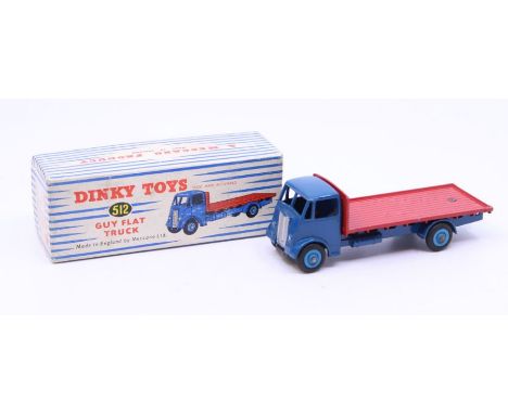 Dinky: A boxed Dinky Toys, Guy Flat Truck, Reference No. 512, blue cab and chassis with red flatbed. Original box, general we