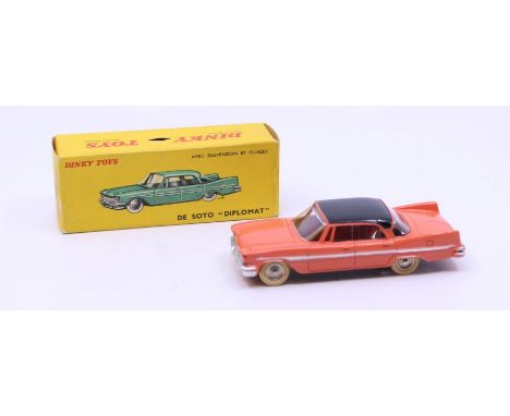 Dinky: A boxed French Dinky Toys, De Soto "Diplomat", Reference No. 545, coral body with black roof. Original box, general we
