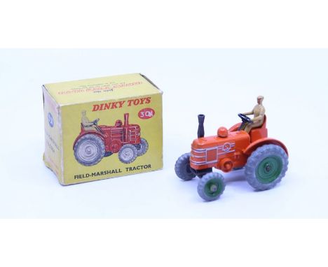 Dinky: A boxed Dinky Toys, Field-Marshall Tractor, Reference No. 301, orange body, tan driver, grey wheels with green wheel h