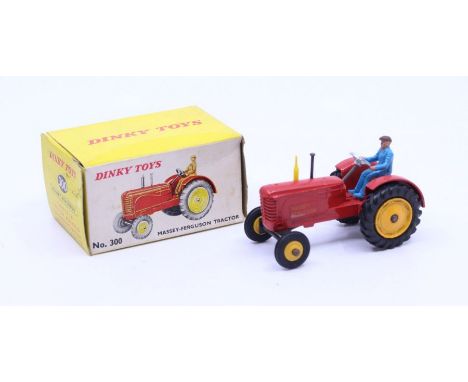 Dinky: A boxed Dinky Toys, Massey-Ferguson Tractor, Reference No. 300, red body, yellow wheel hubs, one black and one yellow 