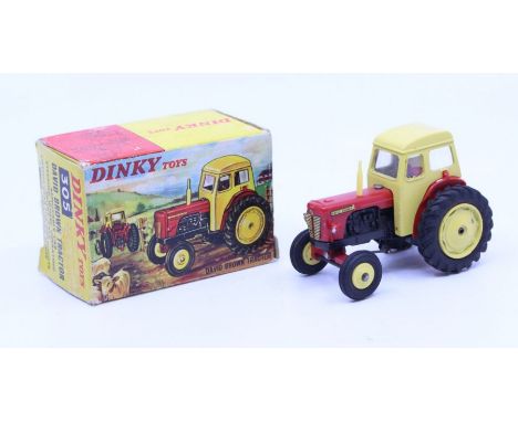 Dinky: A boxed Dinky Toys, David Brown Tractor, Reference No. 305, red and yellow body with yellow wheel hubs. Original box, 