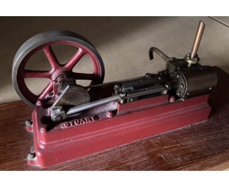 Live Steam: A horizontal stationary engine, Stuart Turner. Measuring approx. 9" length, 5" depth, 4.5" height; upon wooden ba
