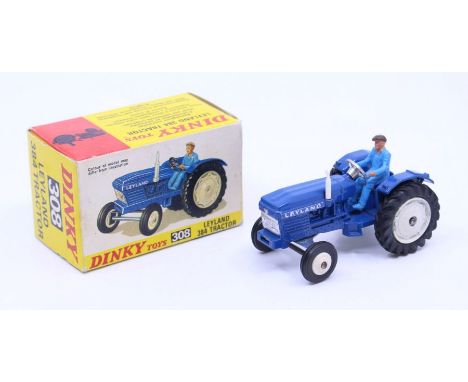 Dinky: A boxed Dinky Toys, Leyland 384 Tractor, Reference No. 308, blue body with white wheel hubs. Original box, general wea