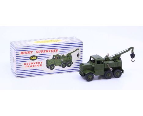 Dinky: A boxed Dinky Supertoys, Recovery Tractor, Reference No. 661, military green body. Original box with inner packing pie