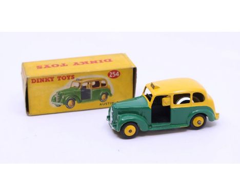 Dinky: A boxed Dinky Toys, Austin Taxi, Reference No. 254, green and yellow body. Original box, general wear expected with ag