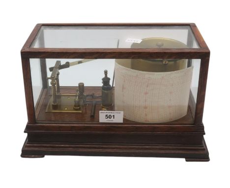 A barograph, housed in a glazed oak case, Pat. no. 22556, measuring approx. 31.5cm x 18.5cm 17cm, with a quantity of spare ch