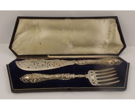 PROBABLY AARON HATFIELD & SONS A PAIR OF SILVER FISH SERVERS having hallmarked blade, tines and filled repousse work handles 