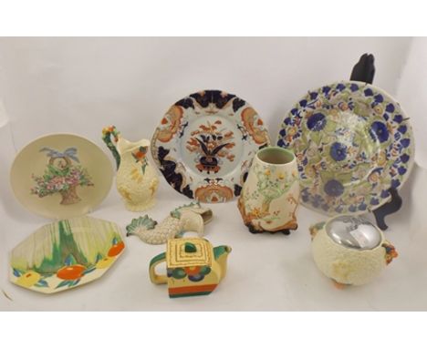 CLARICE CLIFF A SELECTION OF THREE MOULDED EARTHENWARE PIECES, to include a tapered ovoid vase, 20cm high, a baluster ewer, a