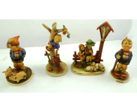 A PAIR OF GOEBELS HUMMEL PORCELAIN FIGURES each of a boy in check jacket, Little Hiker and Farm Boy, 14cm high and two others