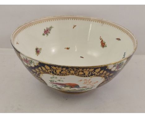 A WORCESTER STYLE BOWL, polychrome decorated with panels of exotic birds and flowers on a blue scale ground, flowers and inse