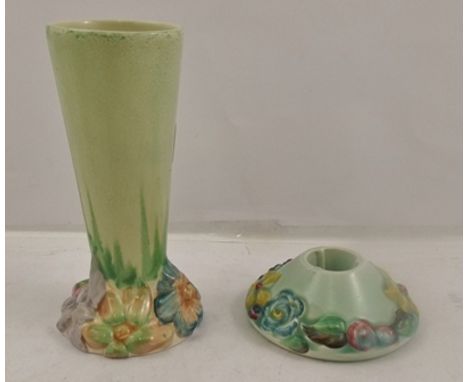 CLARICE CLIFF A SELECTION OF THREE MOULDED EARTHENWARE ITEMS, to include candlestick, platter, 15cm diameter, and a vase, 23c