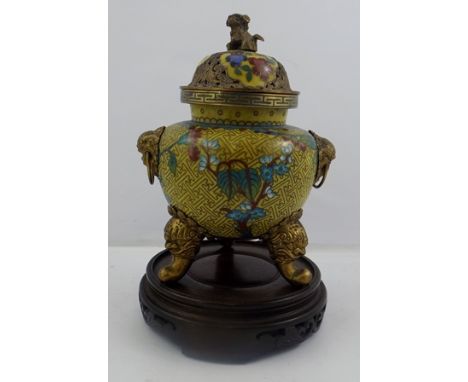 A LATE 19TH CENTURY CHINESE ENAMEL KORO, yellow ground with floral decoration, the body with ring mask handles, on outswept t